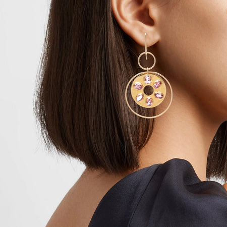 14k gold circular earring with pink tourmaline.